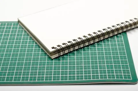 Notebook and cutting mat Stock Photos
