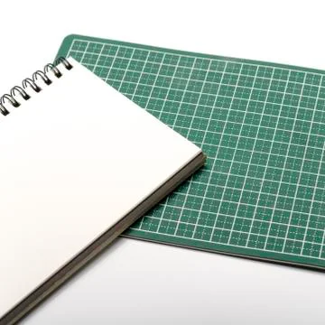 Notebook and cutting mat Stock Photos