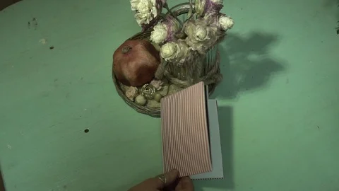 Notebook and flowers the florist's hand moves Stock Footage 123684975