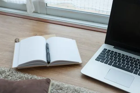 Notebook and laptop computer on floor Stock Photos
