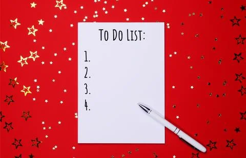 Notebook and pen on background of star-shaped confetti. Stock Photos
