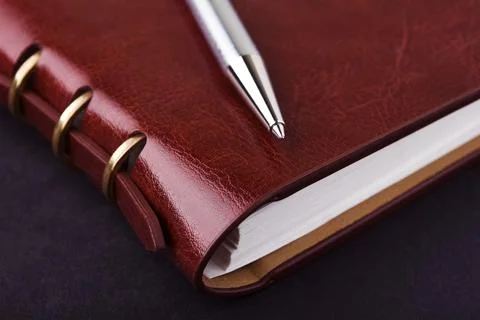 Notebook and pen in composition in black Stock Photos