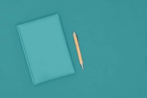 Notebook and pen on mint background. Business concept. Top view, flat lay, copy Stock Photos