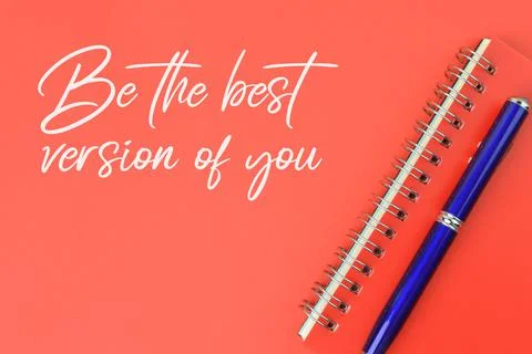 Notebook and pen over red background written with BE THE BEST VERSION OF YOU. Stock Photos