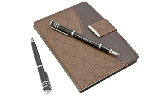 Notebook and pen Stock Photos