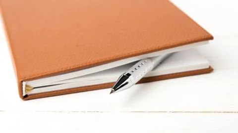 Notebook and pen Stock Photos
