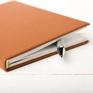 Notebook and pen Stock Photos