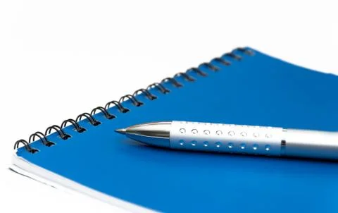 Notebook and pen Fotos de archivo