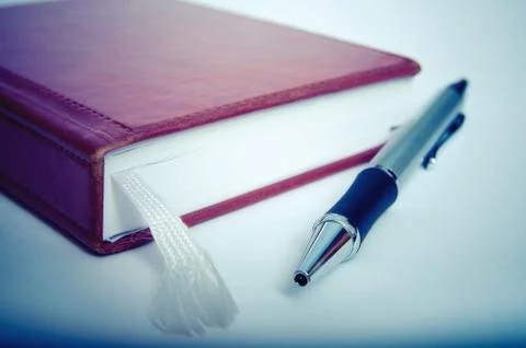 Notebook and pen Stock Photos