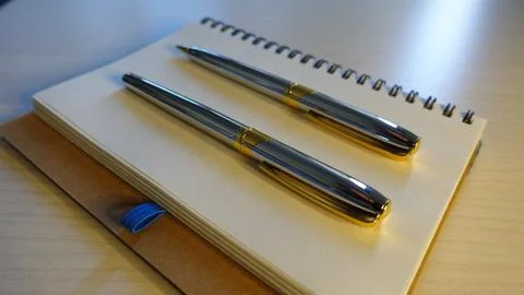 Notebook And Pen Stock Photos