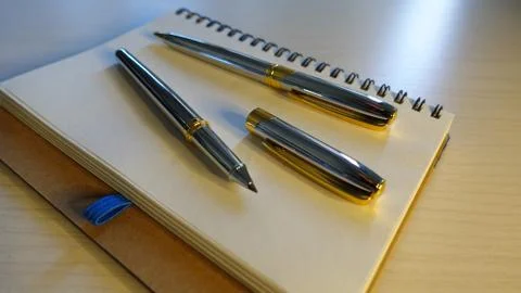 Notebook And Pen Stock Photos