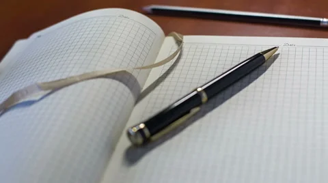 Notebook And Pen. Slider Shot 6 Stock Footage 33304315