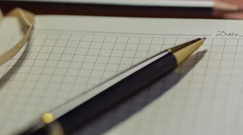 Notebook And Pen. Slider Shot 5 Stock Footage 33304424