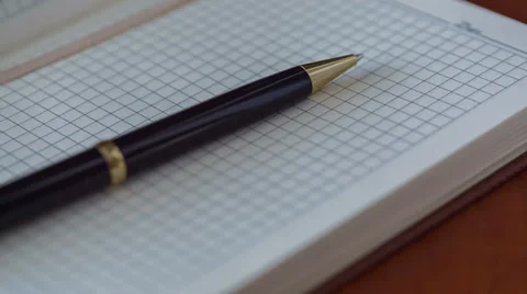 Notebook And Pen. Slider Shot 3 Stock Footage 33304715