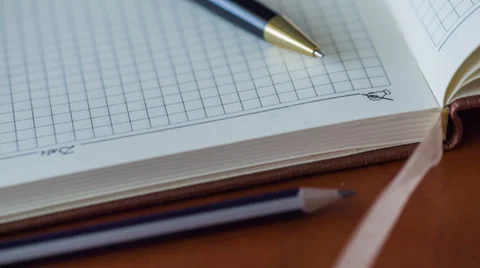 Notebook And Pen. Slider Shot 1 Stock Footage 33304821