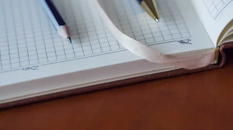 Notebook And Pen. Slider Shot Stock Footage 33875692