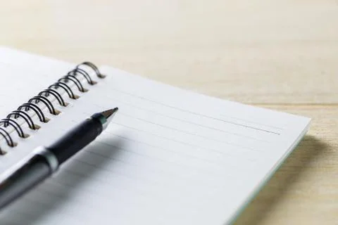 Notebook and pen on table 写真素材