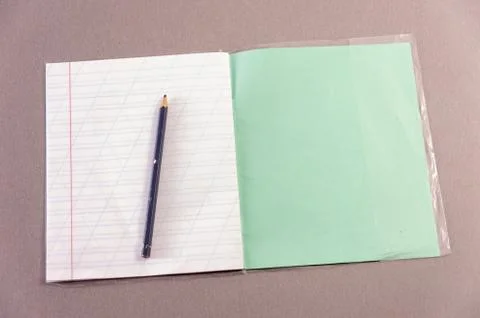 Notebook and pen on the table Stock Photos