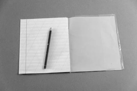 Notebook and pen on the table Stock Photos