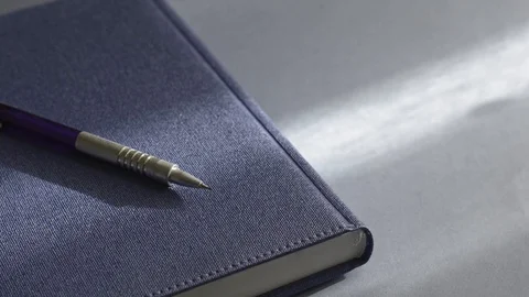 Notebook and pen on a table by the window. Stock Footage 123145118