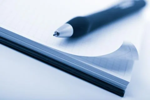 Notebook and pen toned blue Stock Photos