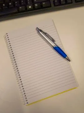 Notebook and pen on white background Stock Photos