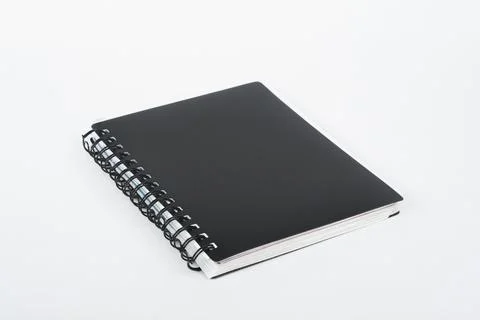 Notebook and pen on a white background. Stock Photos
