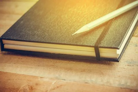 Notebook and pencil Stock Photos
