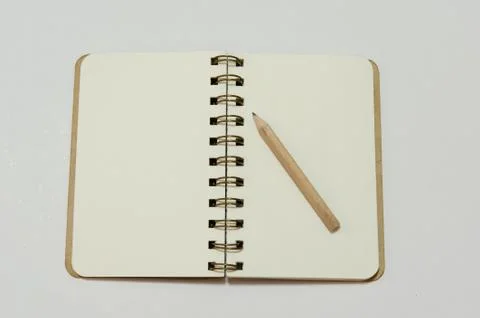 Notebook and pencil Stock Photos