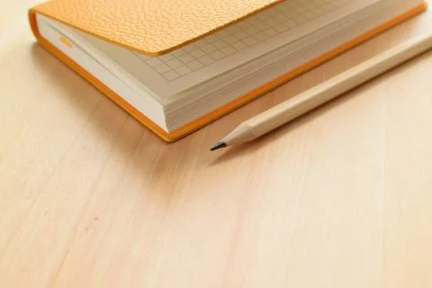 Notebook and pencil Stock Photos
