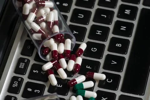Notebook and pills Stock-Fotos