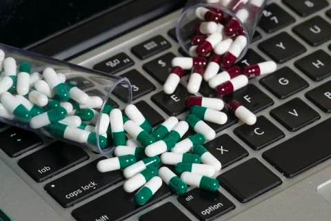 Notebook and pills Stock-Fotos