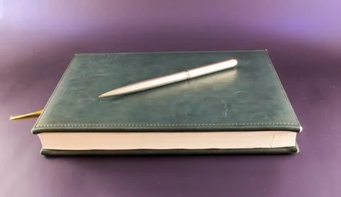 Notebook and Silver Pen. Stock Photos