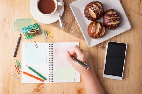 Notebook and sticky paper on wood table in vintage style Stock Photos