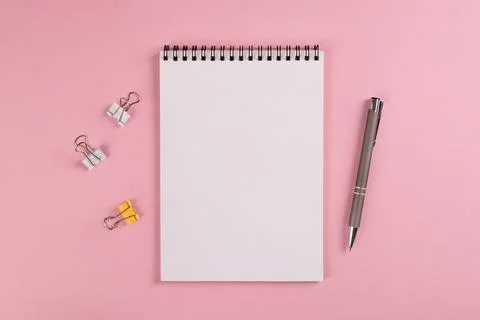 Notebook ,ballpoint pen and multi-colored clips for paper Stock Photos