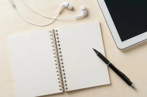 Notebook beside small tablet pc Stock Photos