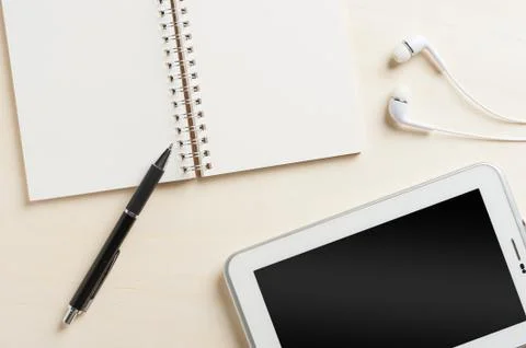 Notebook beside small tablet pc Stock Photos