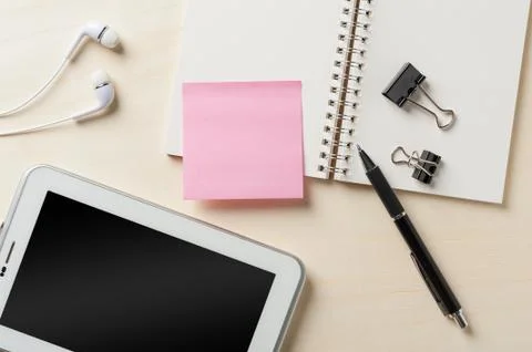 Notebook beside small tablet pc Stock Photos