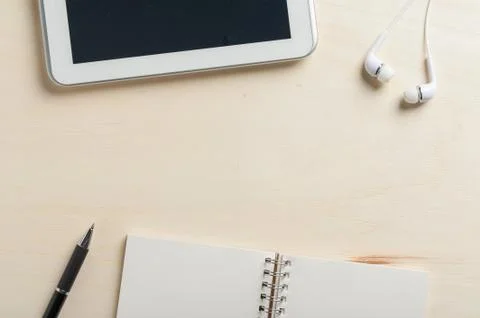 Notebook beside small tablet pc Stock Photos