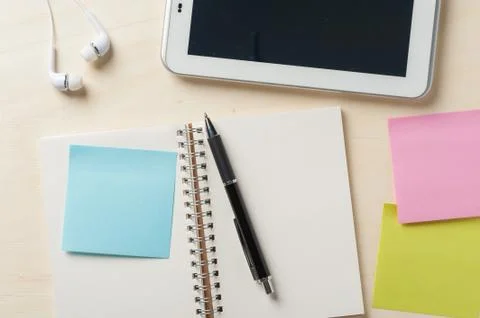 Notebook beside small tablet pc Stock Photos