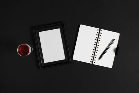 Notebook on black background. Stock Photos