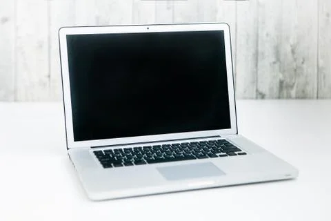 Notebook with black screen on light background Foto stock