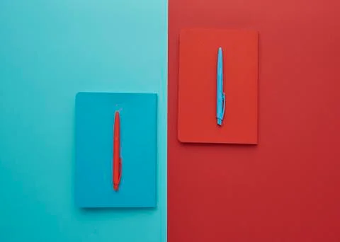Notebook on a blue and red background Stock Photos