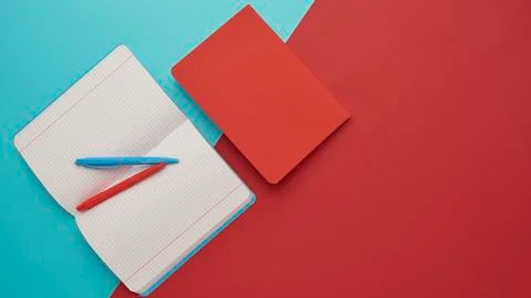 Notebook on a blue and red background Stock Photos