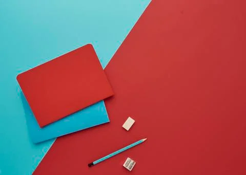Notebook on a blue and red background Stock Photos