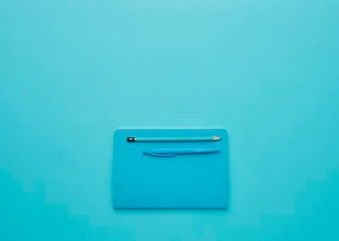 Notebook on a blue background Stock Photos