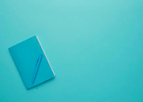 Notebook on a blue background Stock Photos