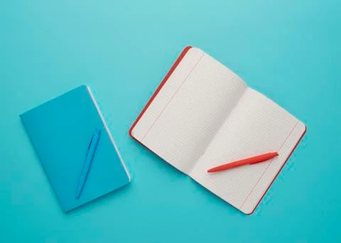 Notebook on a blue background Stock Photos