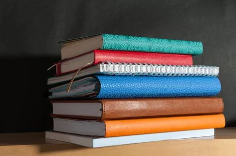Notebook on the bookshelf Stock Photos