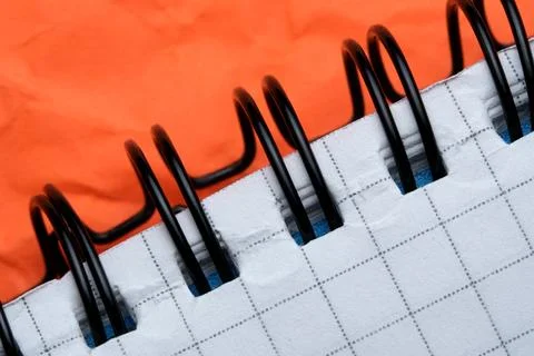 Notebook on bright orange surface Stock Photos